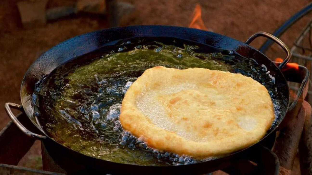 Frybread cooking in a cast iron pan